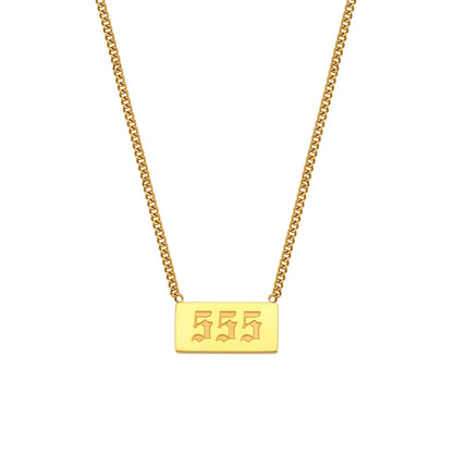 Gold necklace with a rectangular pendant displaying '555' on a white background