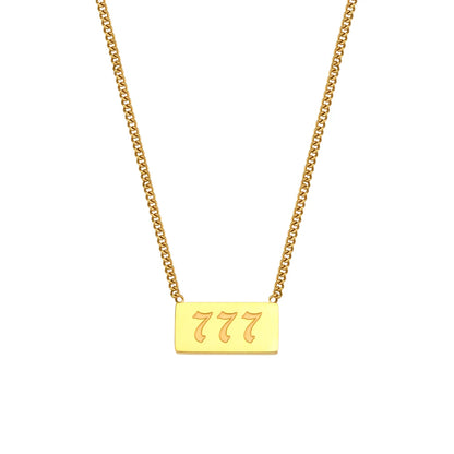 Gold necklace with a rectangular pendant displaying the number 777 on a white background