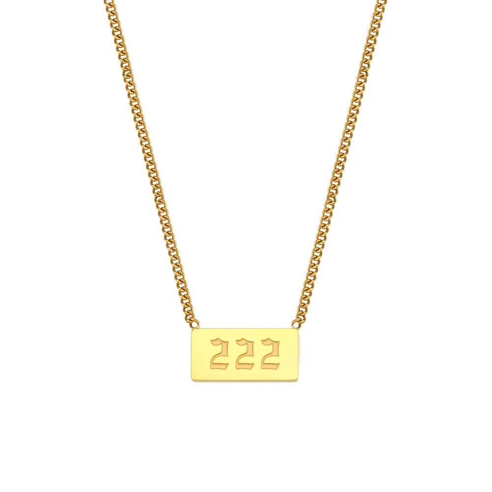 Gold necklace with a rectangular tag displaying '222' on a white background