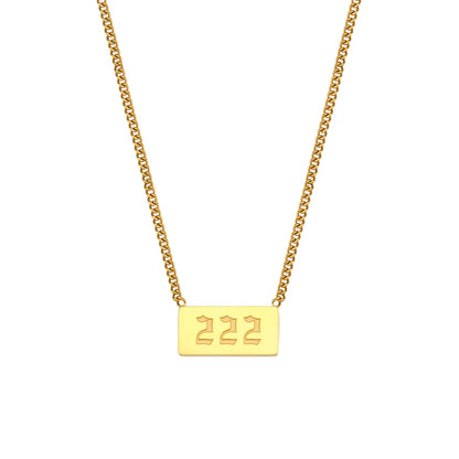 Gold necklace with a rectangular tag displaying '222' on a white background