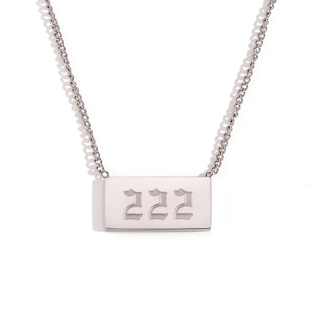 Silver necklace with a rectangular tag displaying '222' on a white background