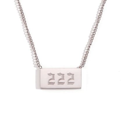 Silver necklace with a rectangular tag displaying '222' on a white background