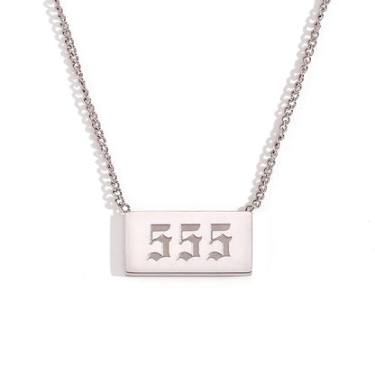 Silver necklace with a rectangular tag engraved with '555' on a white background